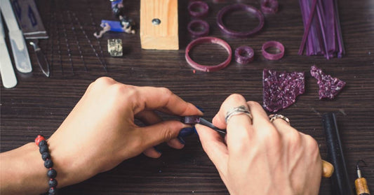Woman carving ring – Kingsley North