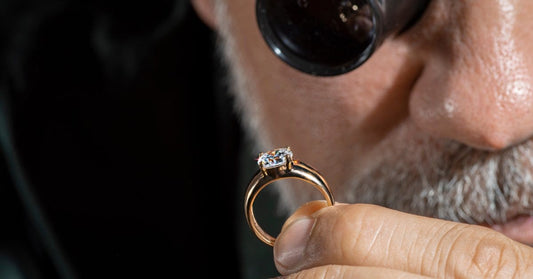 Appraiser examines diamond – Kingsley North