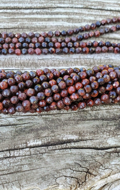 RED TIGER EYE FACETED ROUNDS 4MM